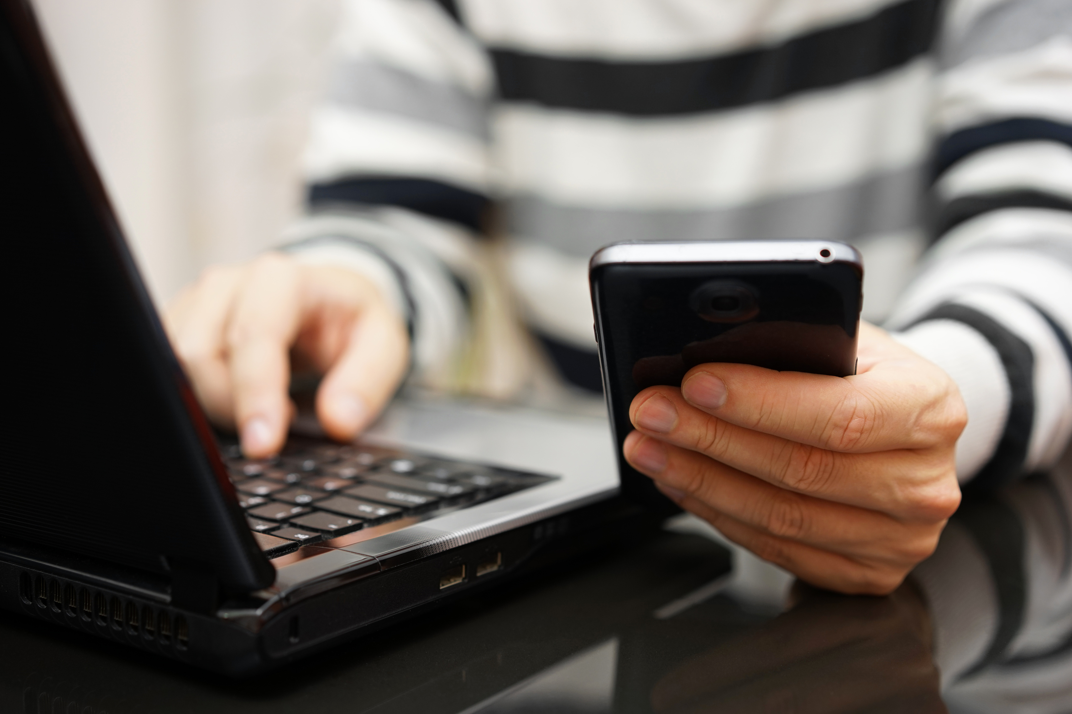 Teenager addicted to the Internet and Social Media using phone a